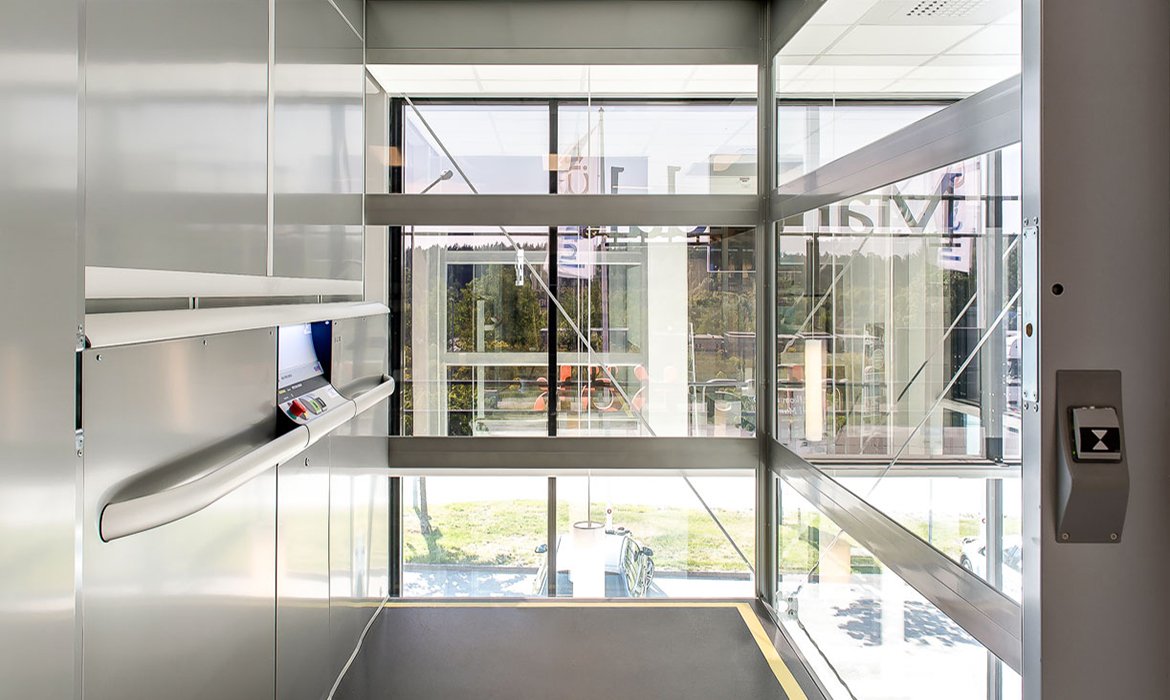 Goods lift with glass shaft view from inside