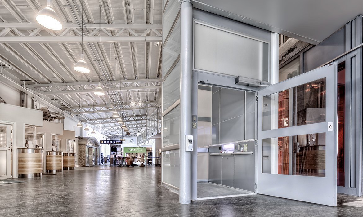 Goods lift in tinted glass at the airport