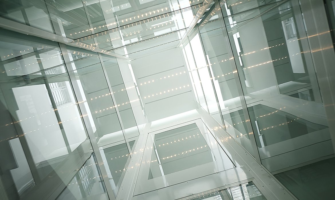 View from inside glass lift in clear glass