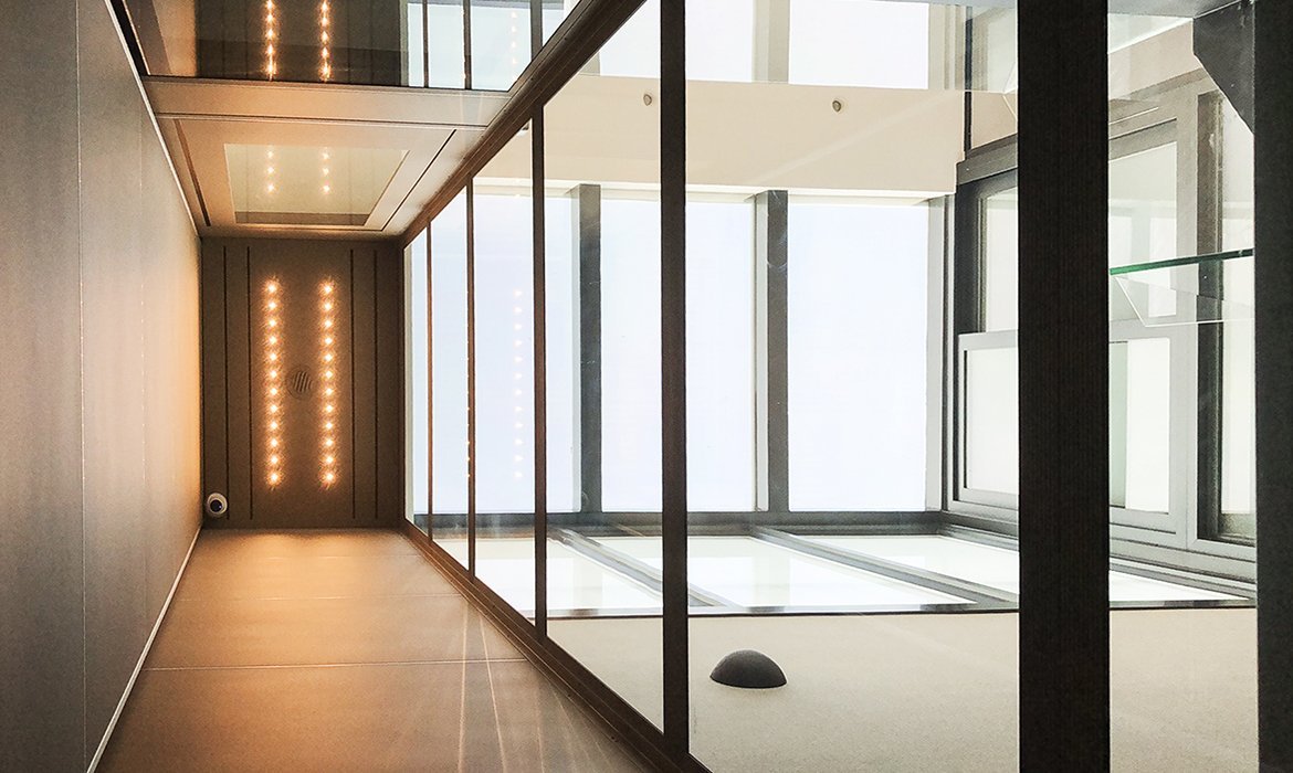 View from inside glass lift in tinted glass