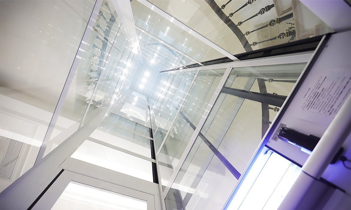 Domestic lift in curved staircase