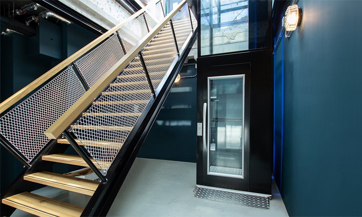 Platform lift placed next to a staircase